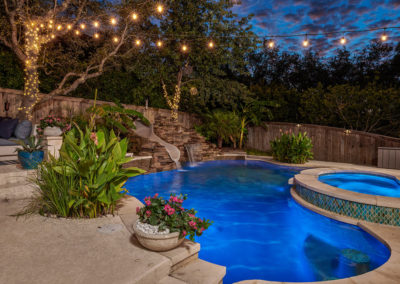 Freeform pool with waterfall, grotto and slide