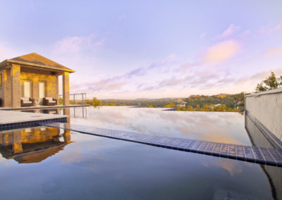 Infinity Pools San Antonio reflecting morning sky.