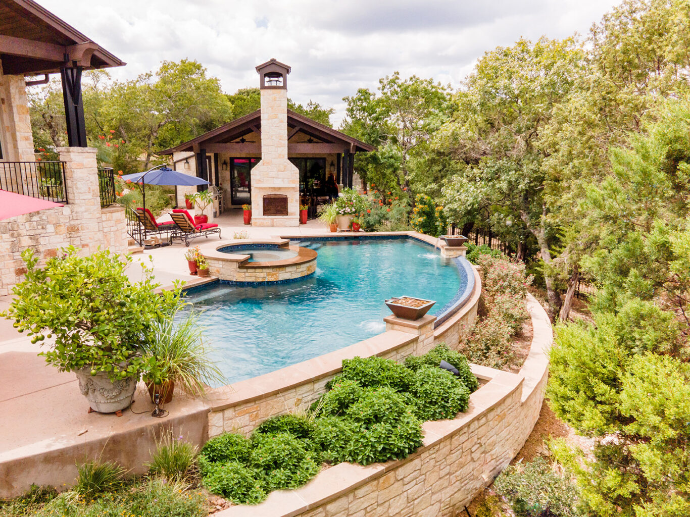pool with water bowls and round spa
